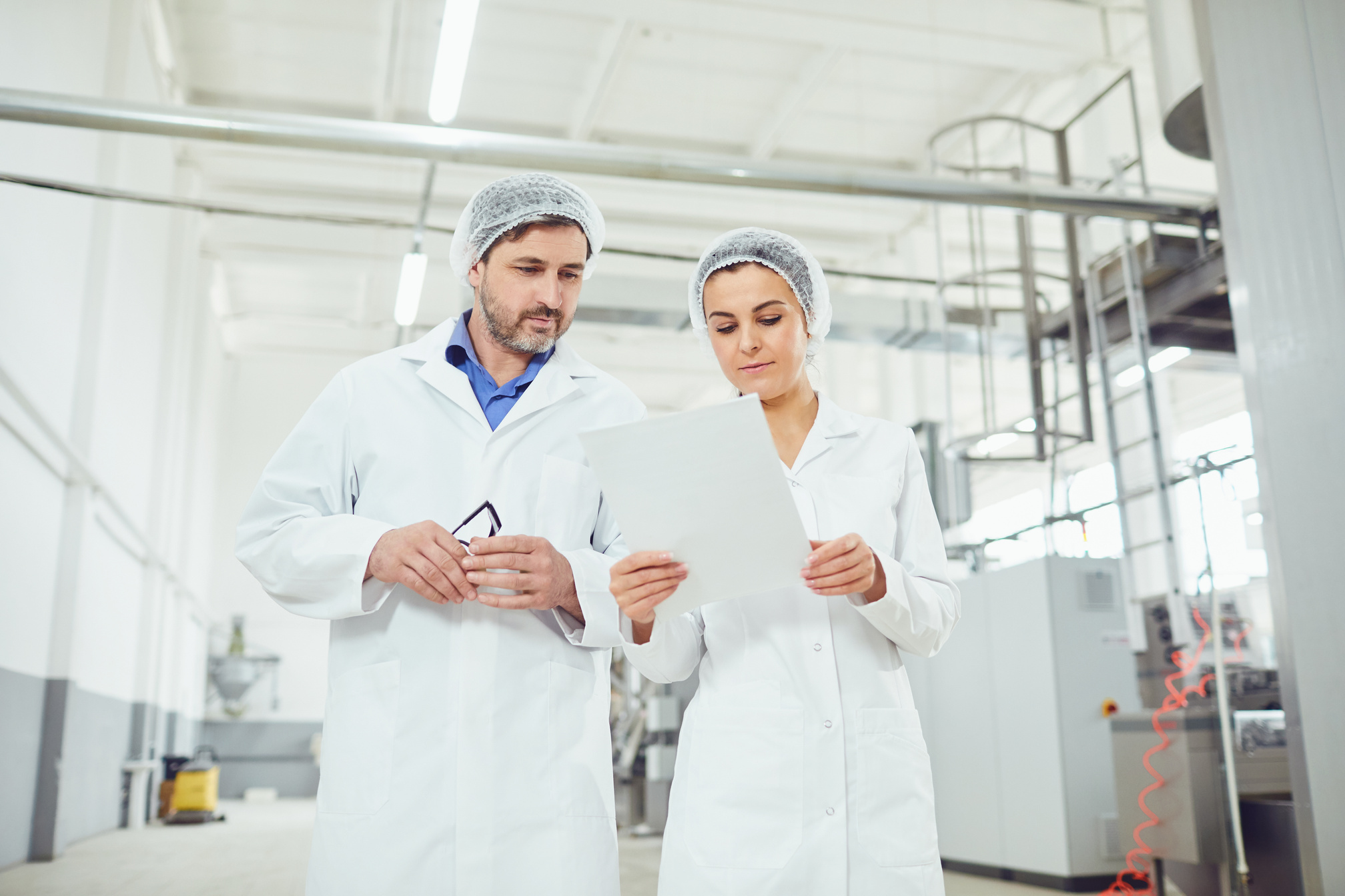 Technologists in Lab Coats at the Factory